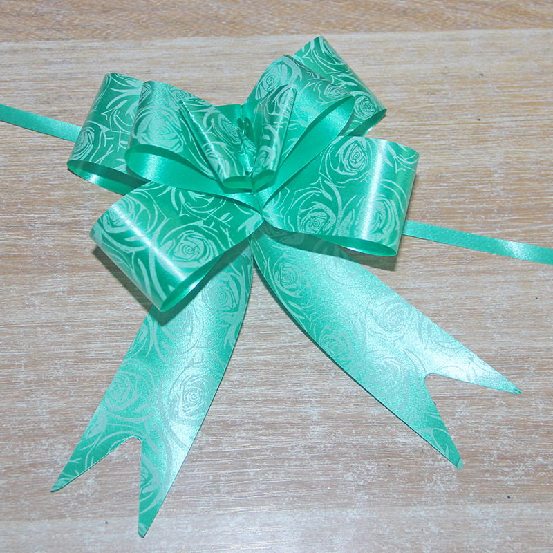 Fabricante al por mayor de empaques de flores para regalos navideños, cinta con borde dorado, 30 flores medianas atadas a mano.