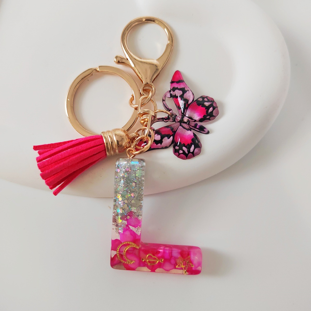 Inventario transfronterizo nueva resina bicolor mariposa borda llavero colgante estrella luna accesorios de joyas