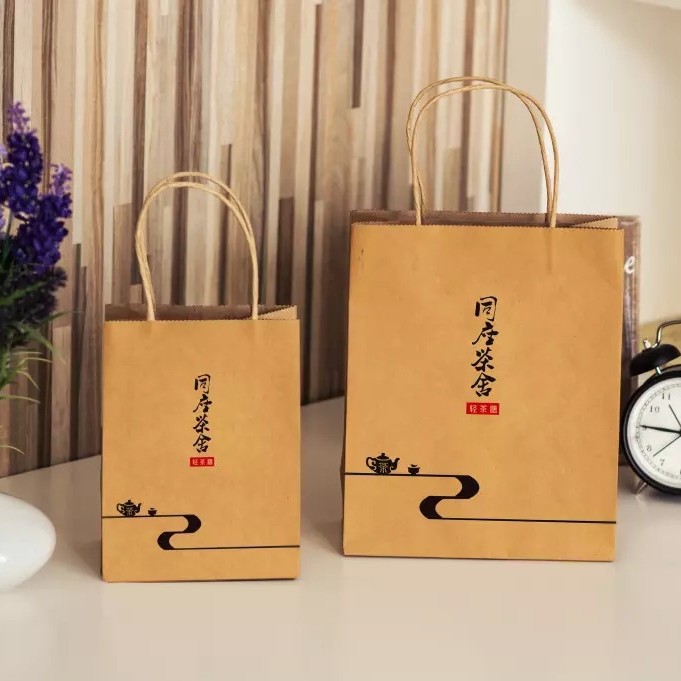 生产厂家可安要求制作广告促销黄色牛皮纸手提袋LOGO 精美纸袋子