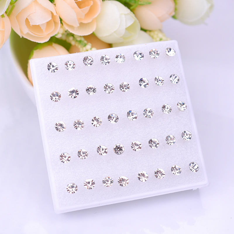 Pendientes de resina, pendientes de plástico, juego de joyería para oreja de mujer, aretes de hueso de la oreja, aretes pequeños en caja, aretes de hueso de la oreja PDD al por mayor