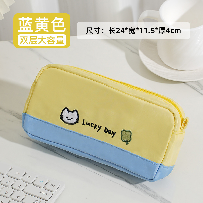 Azul y amarillo - Bolsa de pluma bordada para gatitos de Trébol de cuatro hojas
