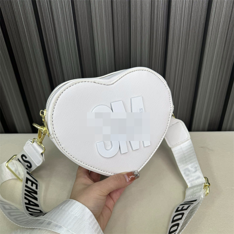 Bolso de hombro transfronterizo para mujer, sentido de alta gama, todo fósforo, letras al por mayor, bolso de mensajero simple, temperamento casual, bolso en forma de corazón
