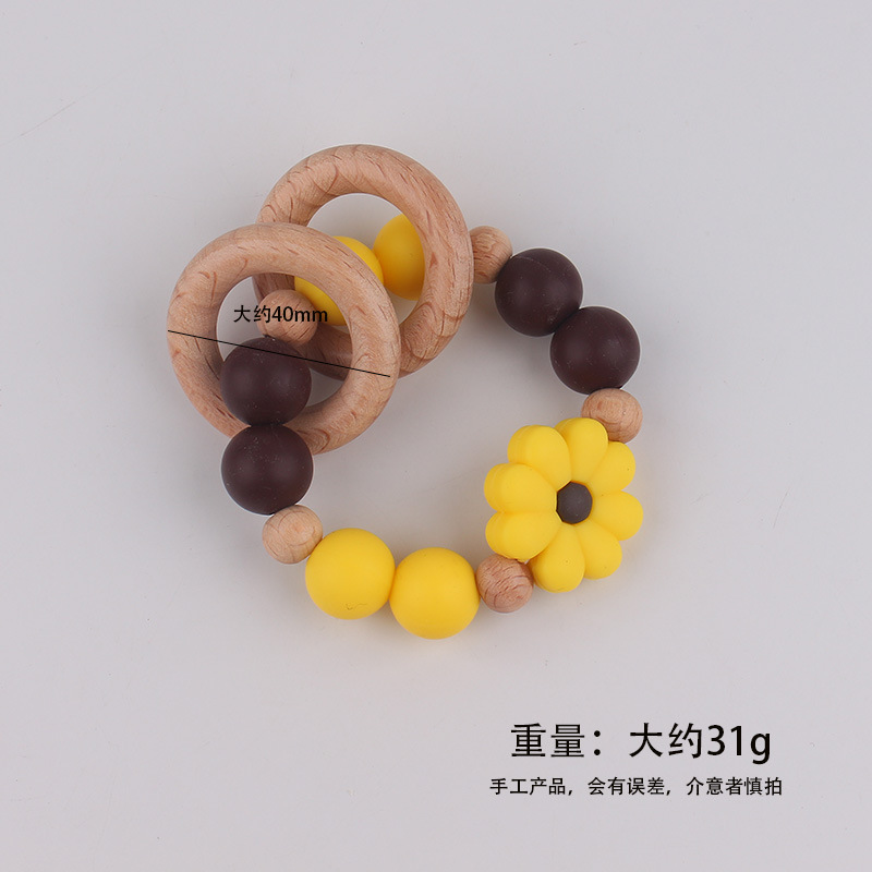 Nuevo juguete de mano para bebé con sonajero, los molares de los niños pueden morder el castaño de haya, margarita, pulsera de flores, mordedor
