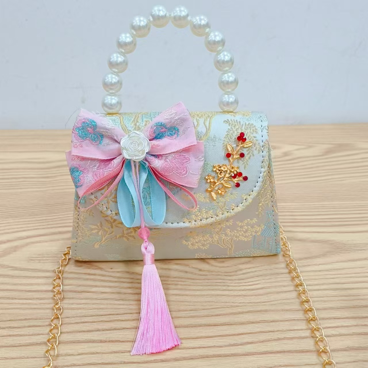 Niños pequeños bolsos de hombro de viento de fragancia de alta calidad exquisita niña antigua bolso de cambio princesa perla bolso de mano