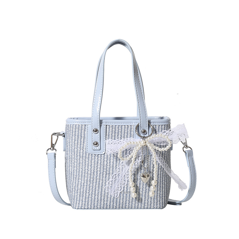 Bolsa de balde de mano caliente de verano para mujeres 2025 nueva bolsa de playa de vacaciones de playa bolsa de tejido bolsa de paja