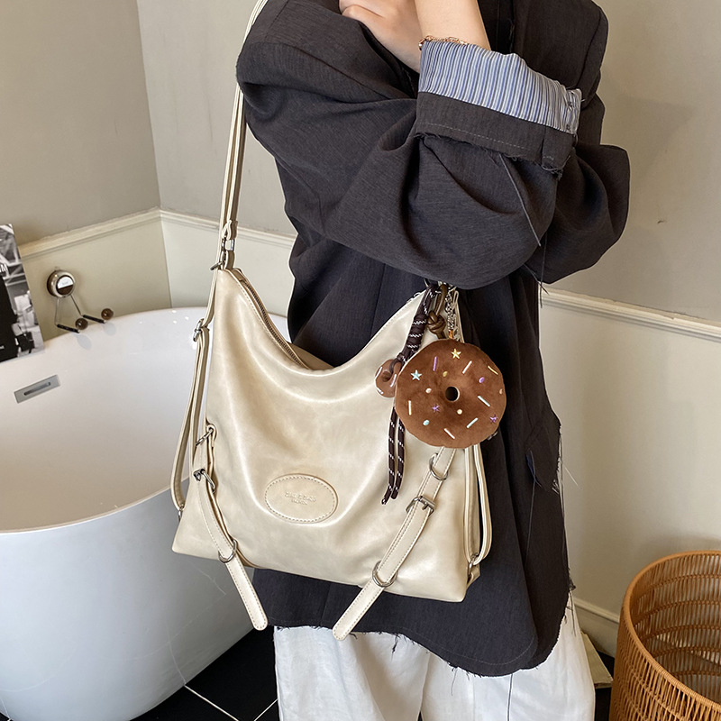 Mochila de viaje casual de mujer de gran capacidad mochila de cuero suave 2025 nueva mochila de estilo relajado retro versátil