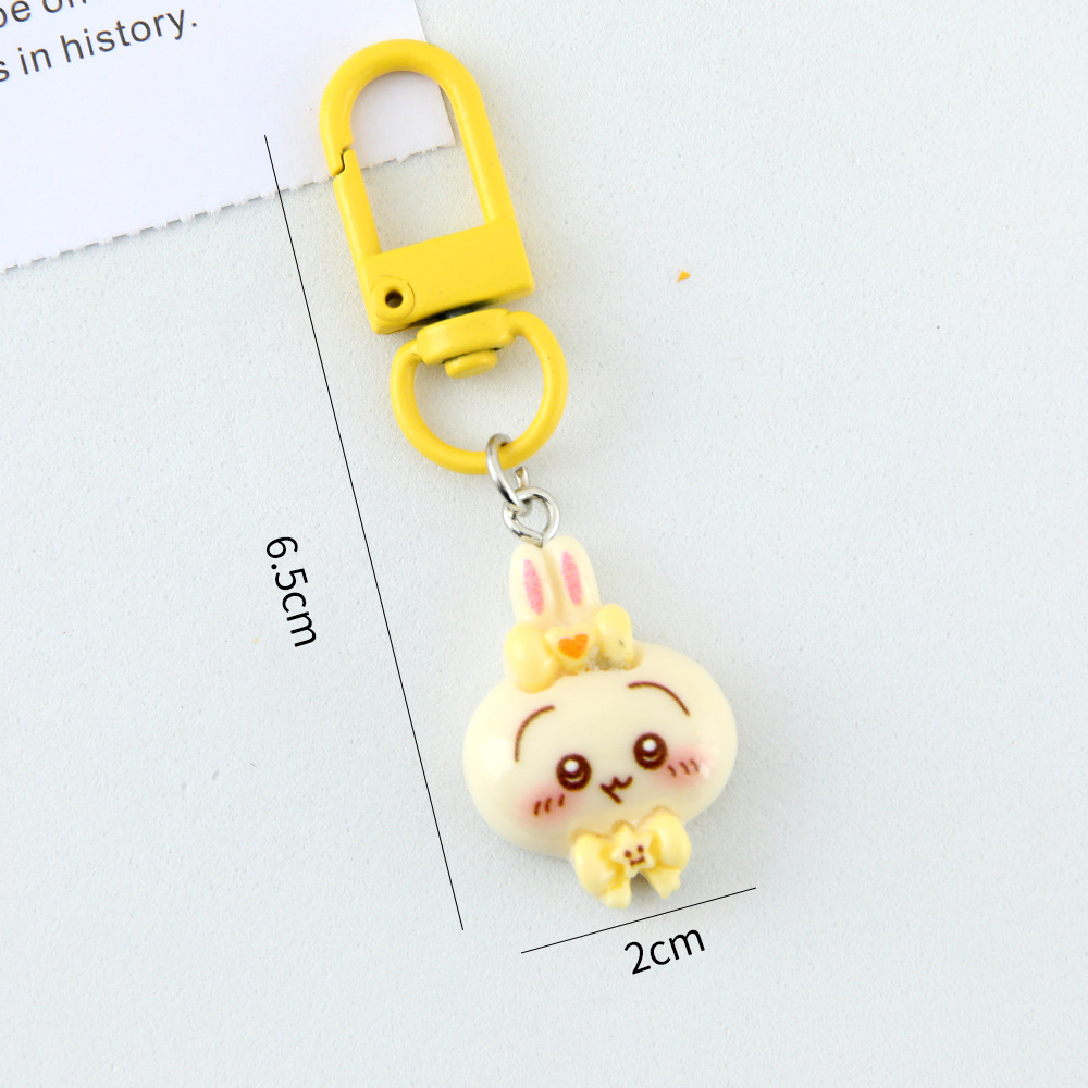 Caricatura linda corbata pequeña ocho llaveros colgantes pareja amigas bolsos colgantes de alto valor de belleza llaveros de corazón de niña