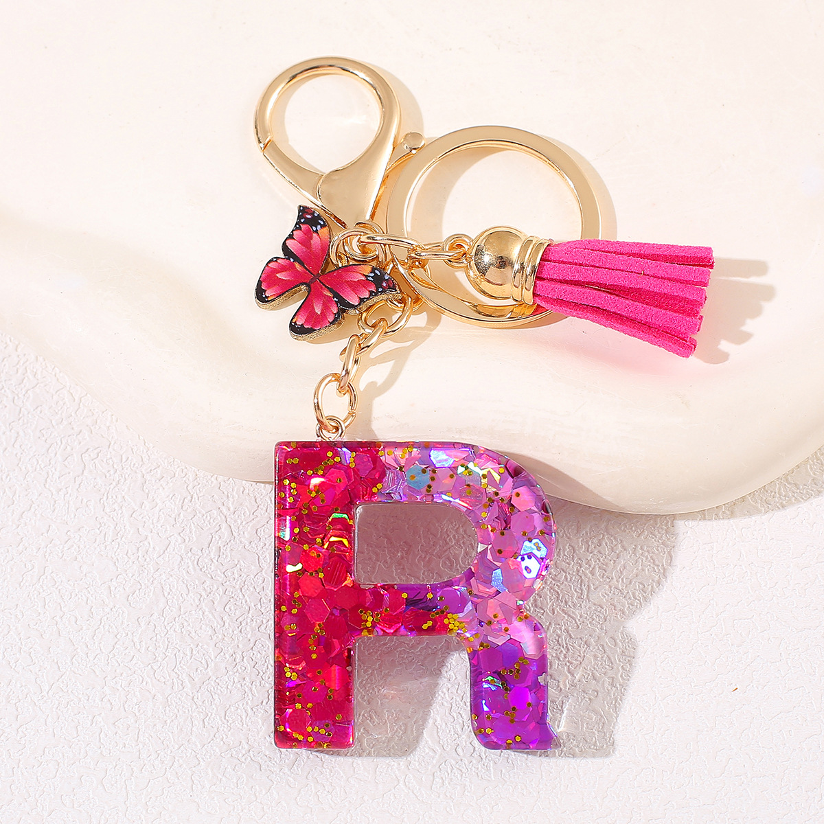 Transfronterizo Amazon 26 letras llavero de goteo de goma esquinilla gradiente letras mariposa llavero bolso de mujer colgante