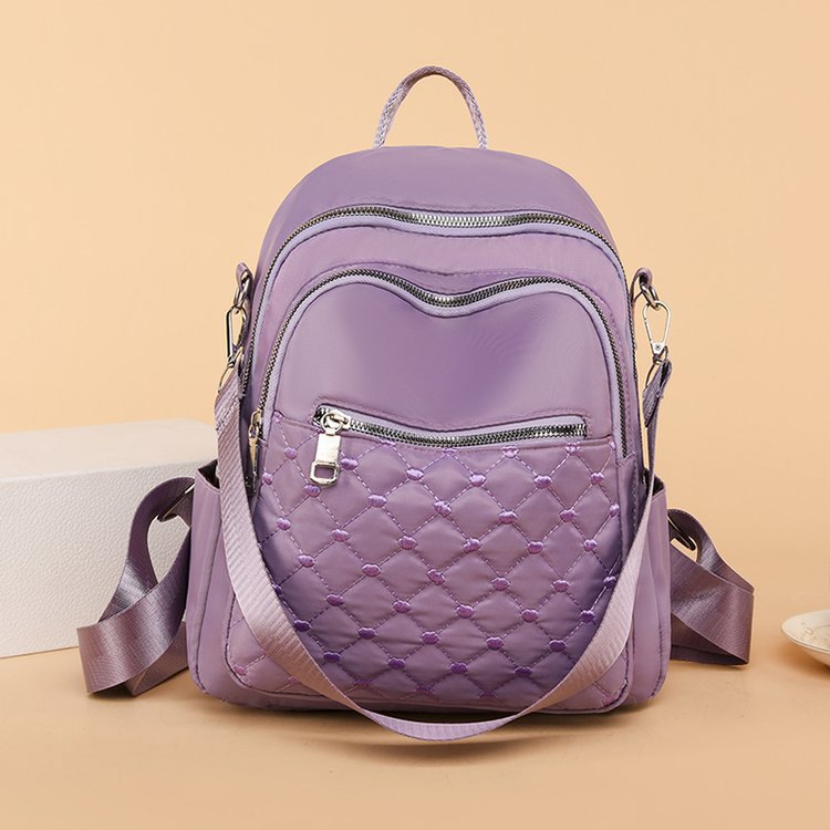 Primavera y verano nueva moda multifuncional de doble uso un solo hombro y doble hombro bordado estilo universitario deportes al aire libre tiro real bolso femenino al por mayor