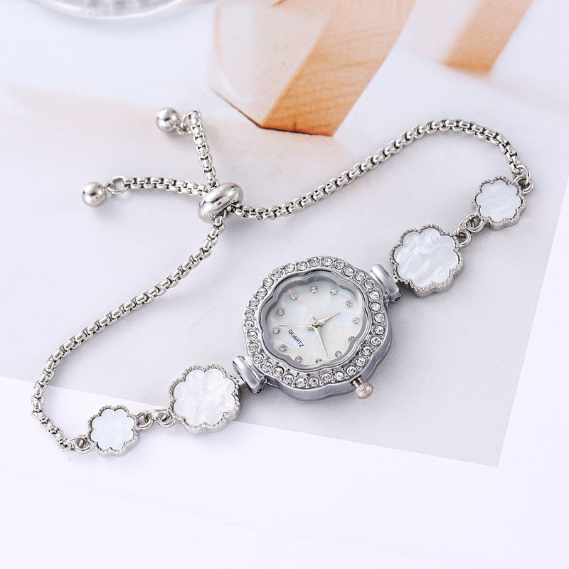 Reloj estudiante femenina transfronteriza Girasol Diamante ins estilo universitario elegante pequeño dial decoración pulsera perezosa