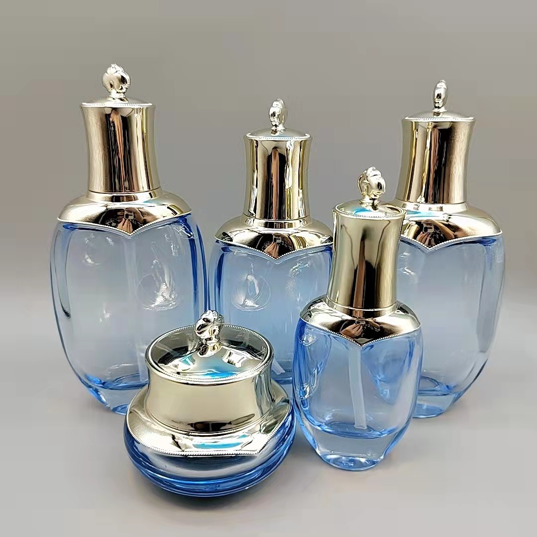 Fábrica en stock suministro de clima Dan mismo estilo conjunto botella de esencia botella de loción botella de pasta de dama botella de vidrio cosmético