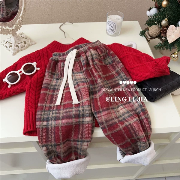Red colored velvet trousers