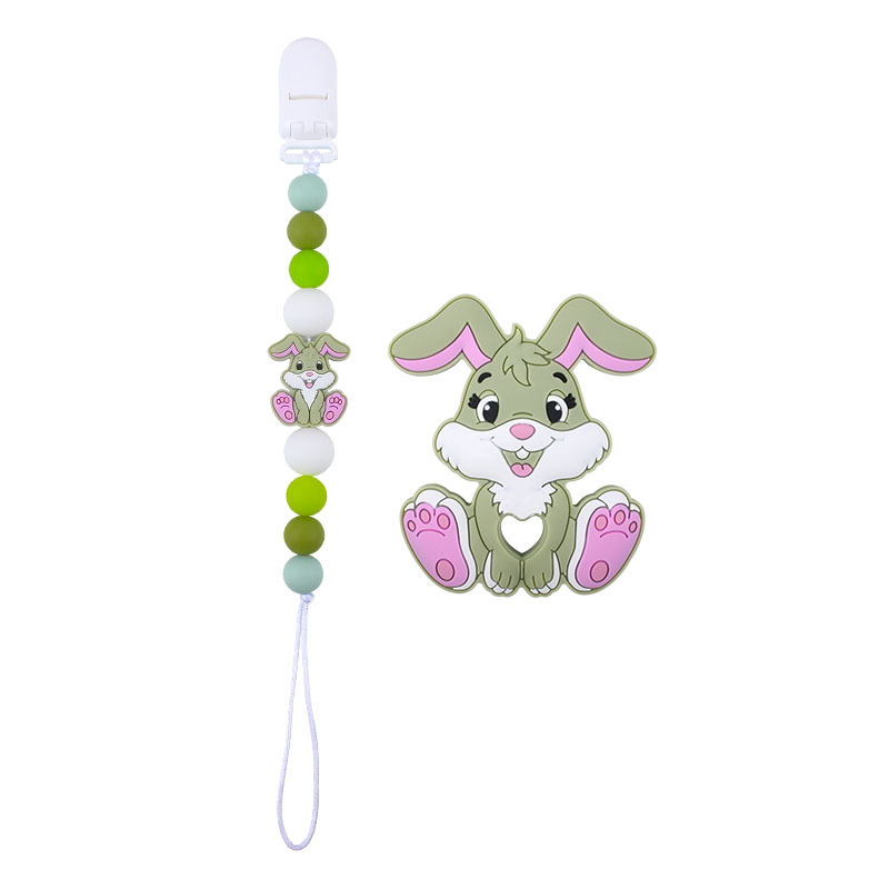 Amazon nuevo bebé suministros de dibujos animados conejo de silicona juguete mordedor pezón anti-gota cadena molar traje