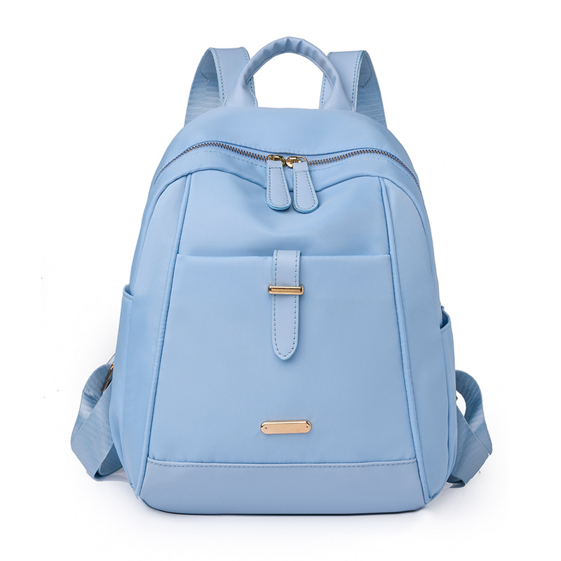 Spot al por mayor 2023 nueva mochila de nailon para mujer coreana moda contraste color al aire libre mochila de viaje portátil marea