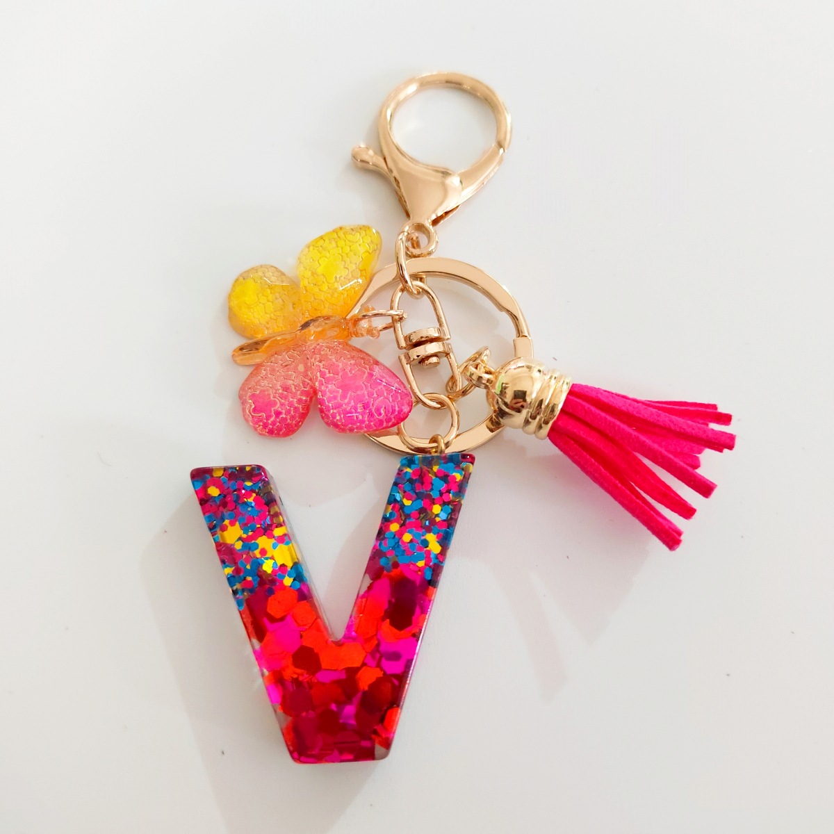 Ventas transfronterizas calientes de letras inglesas de color mixto colgante de llavero colgante de mariposa fringe de resina de llavero colgante de joyería