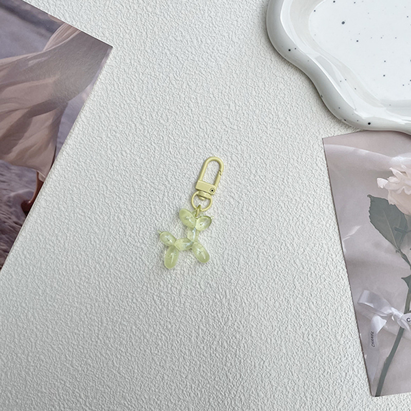 Pequeño Libro Rojo mismo lindo jalea globo láser perro llavero colgante colorido cachorro de dibujos animados teléfono llavero