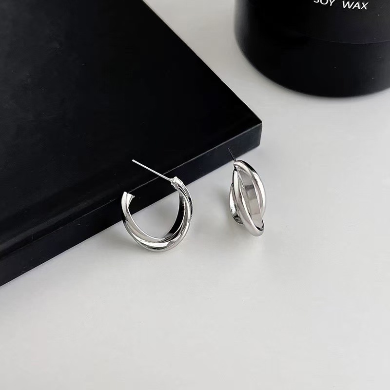 A pair of silver earrings [copper plated with real gold]