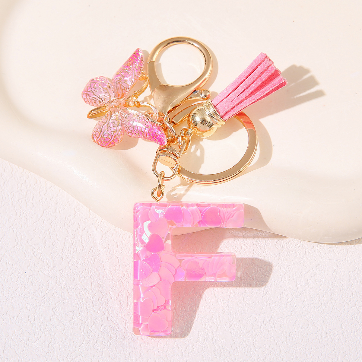 Nuevo rosa damas letras A-Z llavero de goteo de goma sequilla amor letras bordas mariposa llavero transfronterizo