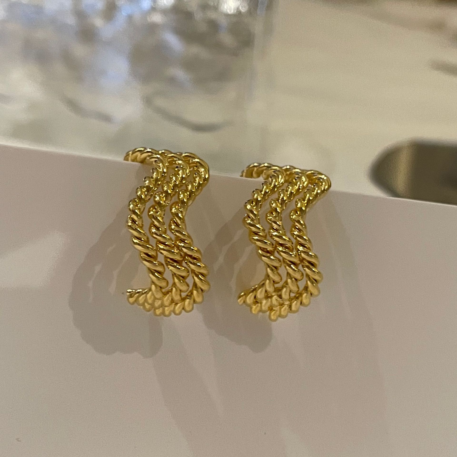 Fashion Gold Plated Metal Texture Wave Winding Earrings display picture 8