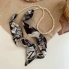 Necklace from pearl with letters