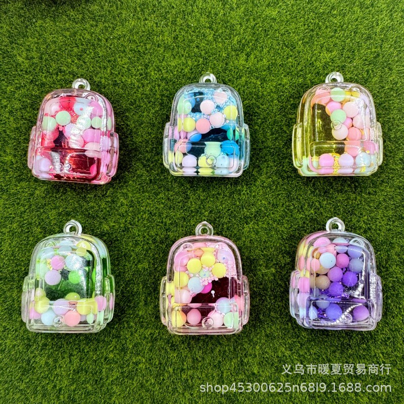 Cartoon oil liquid quicksand schoolbag bottle key chain exquisite bag pendant ornaments doll machine small gift wholesale