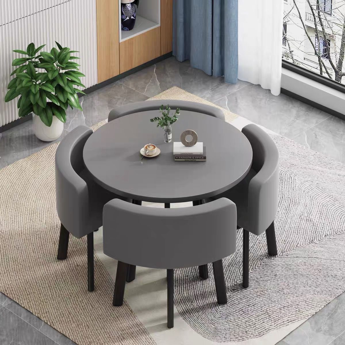 Gray round table + four chairs dark gray leather chairs