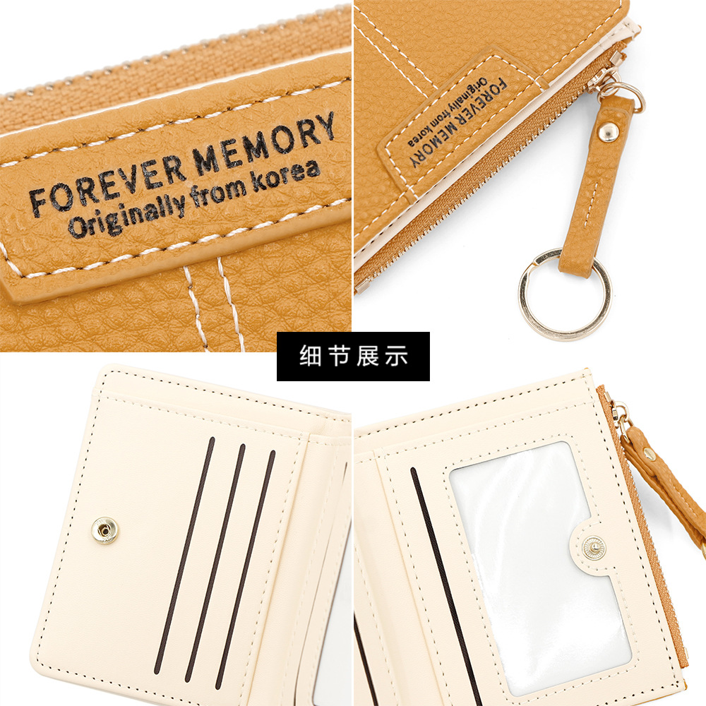 Versión coreana de la nueva billetera corta para mujer, llavero simple, billetera de monedas, billetera de dos pliegues para estudiantes al por mayor