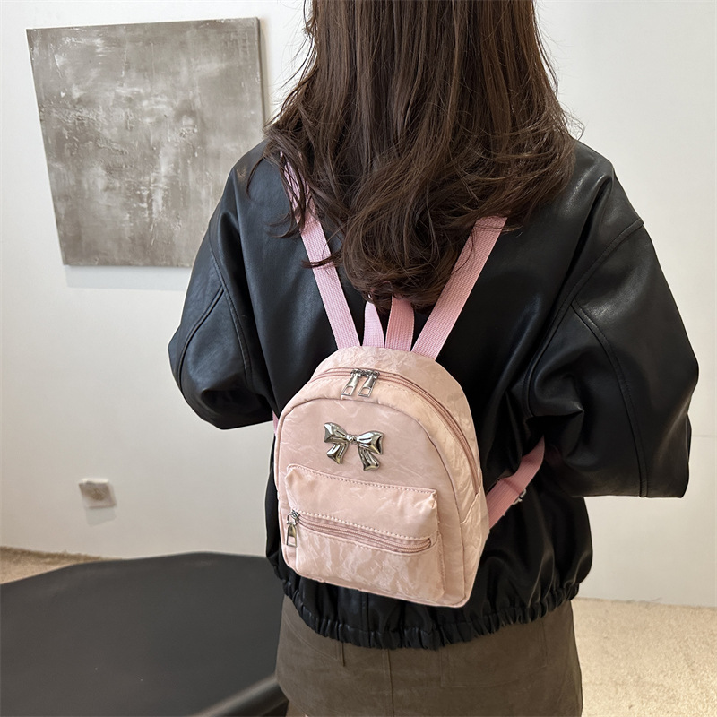Mochila de arco para mujeres, estilo de estilo casual, moda coreana, mochila de balde, mochila de viaje pequeña y ligera