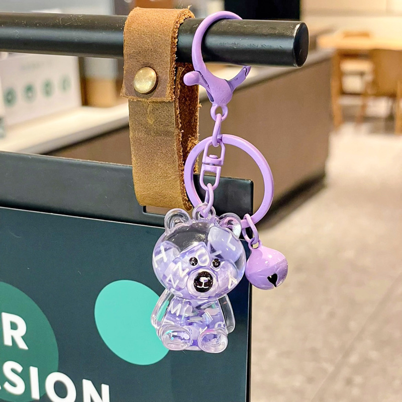 Caricatura en aceite líquido arena flotante botella mochila llavero delicado colgante accesorios accesorios máquina de muñecas pequeños regalos al por mayor