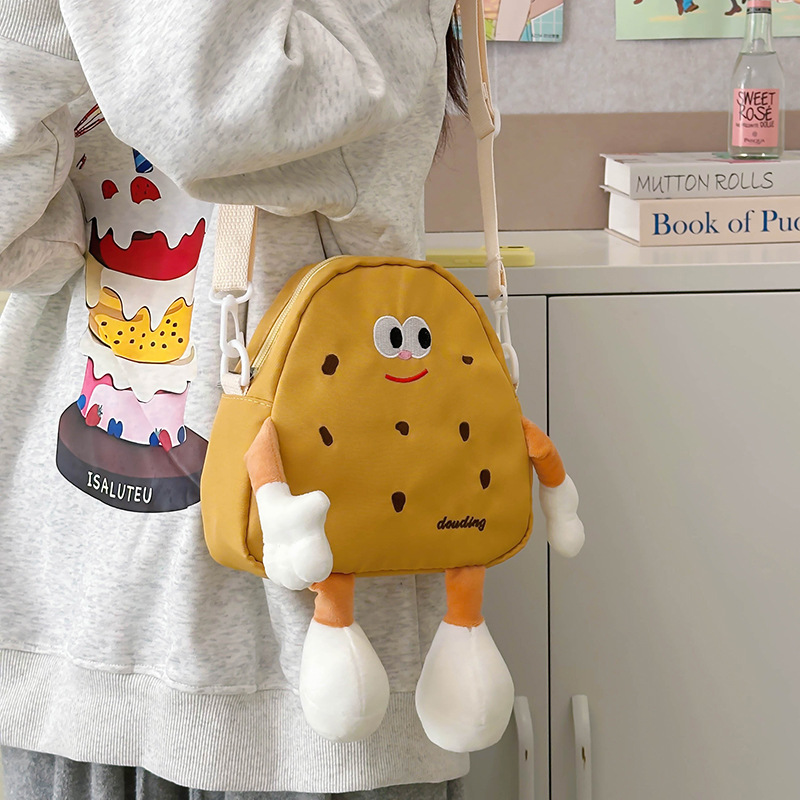 Bolsos de hombro de dibujos animados japoneses para niños y niñas lindos y interesantes pequeñas galletas bebés mochila 2025 nuevo tipo de bolsos para niños