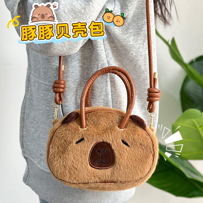 Bolsa de conchas de animales de peluche de red Kapibara muñeca del Dolphin de agua mochila de 8 pulgadas bolsa agarrada al por mayor en stock