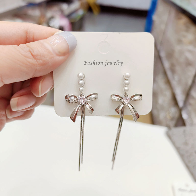Long earrings pearl with zircon with bow
