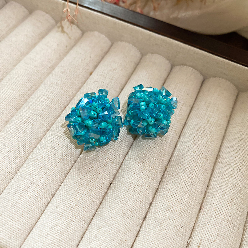 Pendientes de tejido de cristal de flor redonda de aguja de plata Pendientes de todo fósforo de viaje Pendientes de temperamento de moda femenina Sensación de nicho de alto nivel