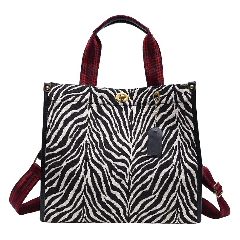 Bolso con estampado de leopardo para mujer 2024, nuevo bolso tote retro de moda para ir al trabajo, con hebilla texturizada, bolso bandolera de un solo hombro.