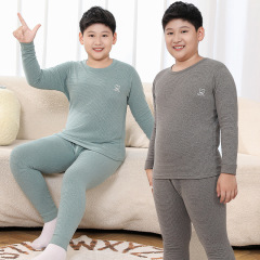 青少年の太った子供の両面の毛の下着のスーツの中で大きい子供は底を打って太って男性のパジャマの学生の底のシャツをプラスします。
