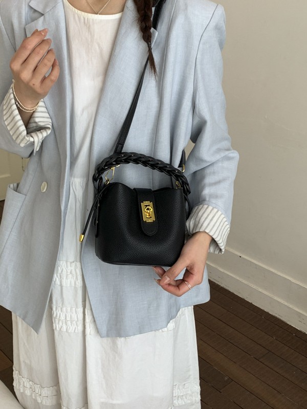 Bolsos de balde portátiles de alta calidad para mujeres 2026 verano nuevo lichi estampado viaje diario ocio versátil mochila