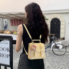 黄色双肩书包包女式新款轻奢小众设计感通勤小背包