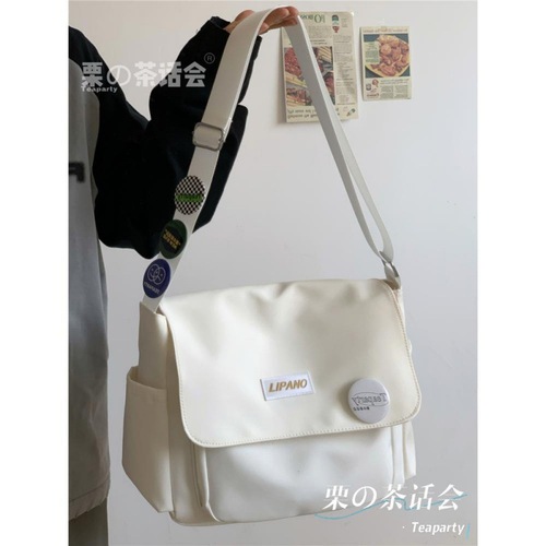 Tea party style Japanese INS Hong Kong style versatile artistic streetwear unisex postman shoulder bag for men trendy student crossbody bag for women