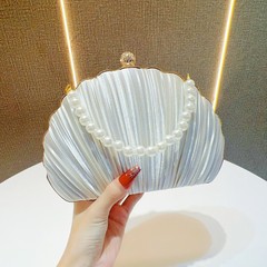 国境を越えた新しい貝殻の晩餐会は欧米の女性のハンドバッグの真珠の宴会を包んで手をつないでドレスのイブニングバッグを持ちます。