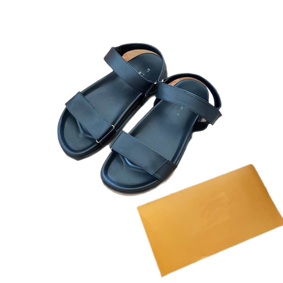 Donkey Home estación europea diseñador de alta versión 2025 nuevas sandalias de playa de cuero zapatillas de hebilla metálica plana
