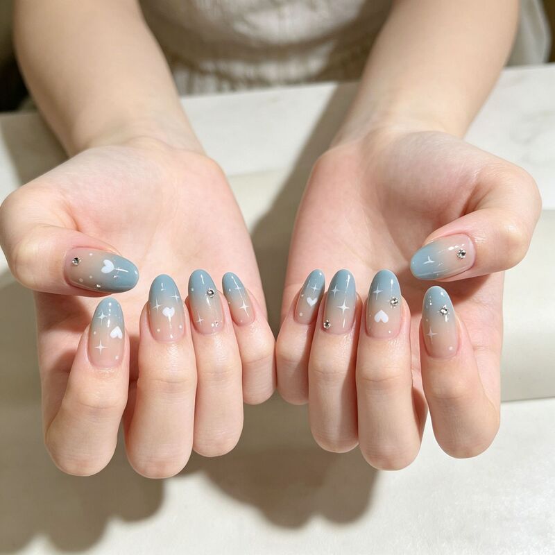 Summer 24-Piece Nail Art Set with Star Designs, Blue Gradient, Stars, and Hearts, Medium-Length Almond-Shaped Nail Tips Summer 24-Piece Nail Art Set with Star Designs, Blue Gradient, Stars, and Hearts, Medium-Length Almond-Shaped Nail Tips