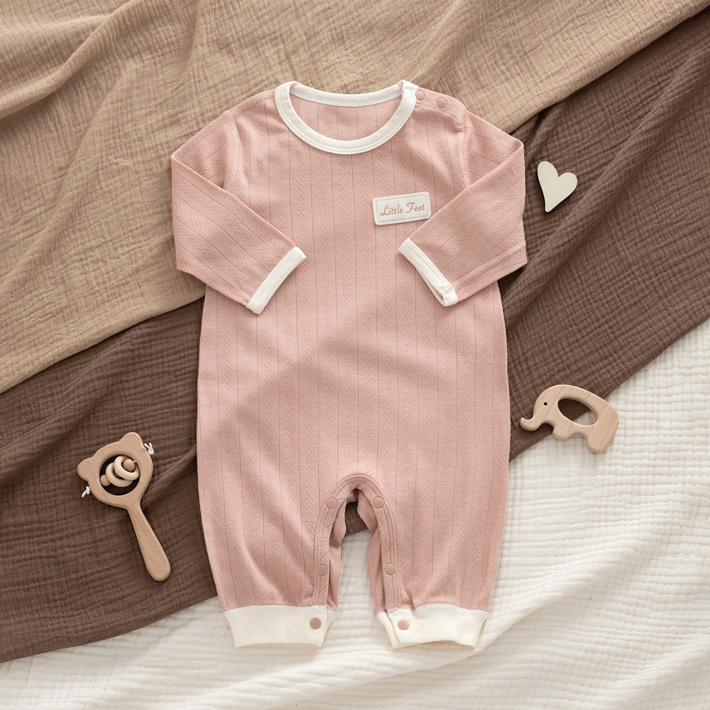 One pink cotton-padded bodysuit