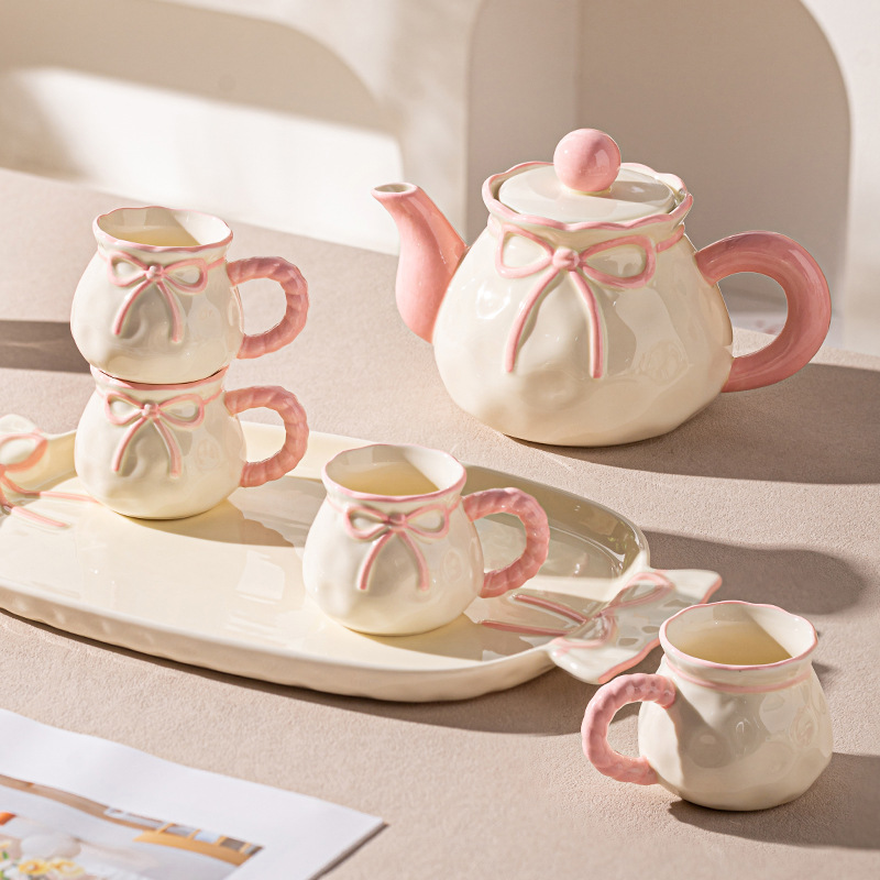 Ceramic water and tea set for moving into a new home, a wedding gift, or a wedding favor for the newlyweds.