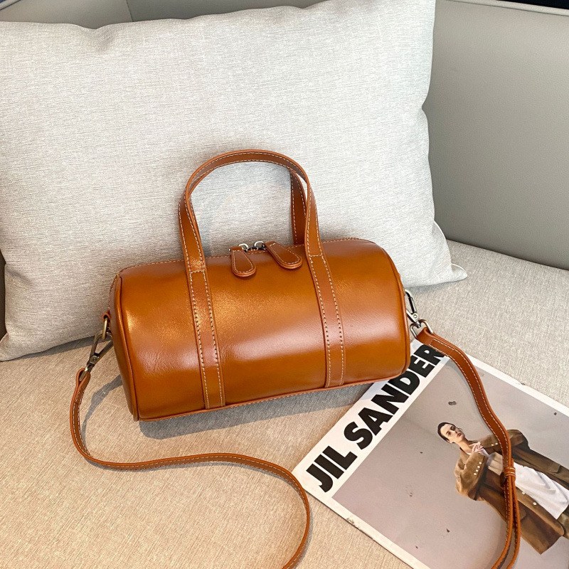 植なめしの上の牛革の枕の包みの女性の高級感の百合の小さい大衆のハンドバッグの女子学生のファッションのボストンバッグの女性