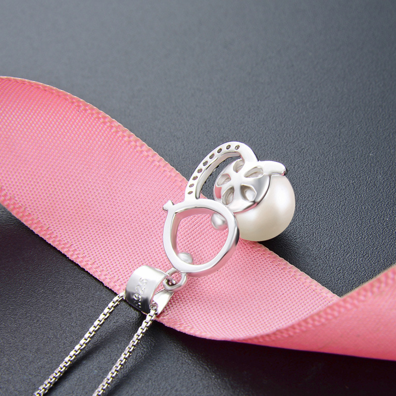 S925 plata esterlina serpiente perla colgante mujer simple ligero lujoso hueco sensación de diseño colgante de plata zodiacal al por mayor