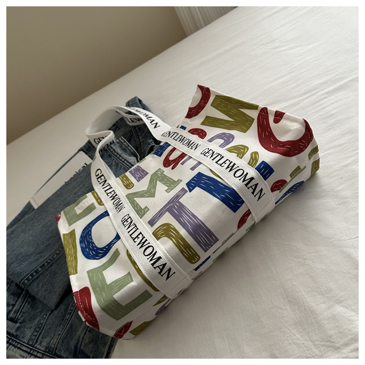 Large-capacity letter canvas bag 2025 new style ins printed versatile shoulder bag for commuting and portable ladies' tote bag undefined