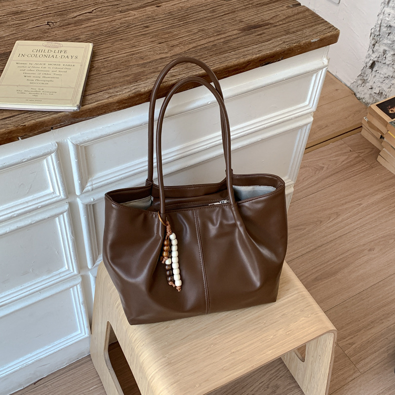 Bolso 2026 nuevo retro bolso de hombro de transporte de gran capacidad bolso de mujer simple y versátil bolso de brazo portátil