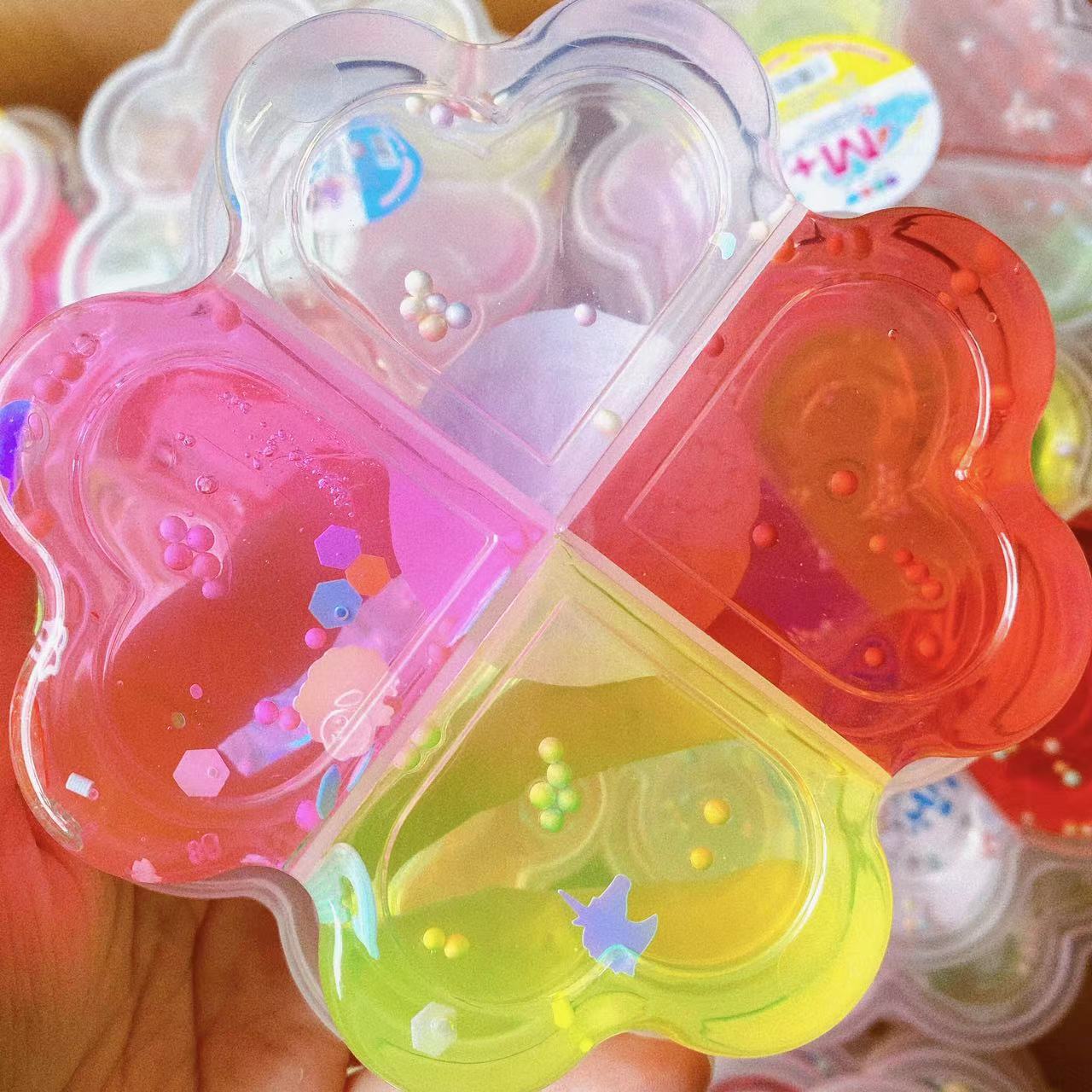 Nueva melocotón en forma de corazón de cristal de barro Trébol de alta permeabilidad pegamento espumante 4 Rejilla 4 Color de descompresión DIY Delgado fábrica al por mayor