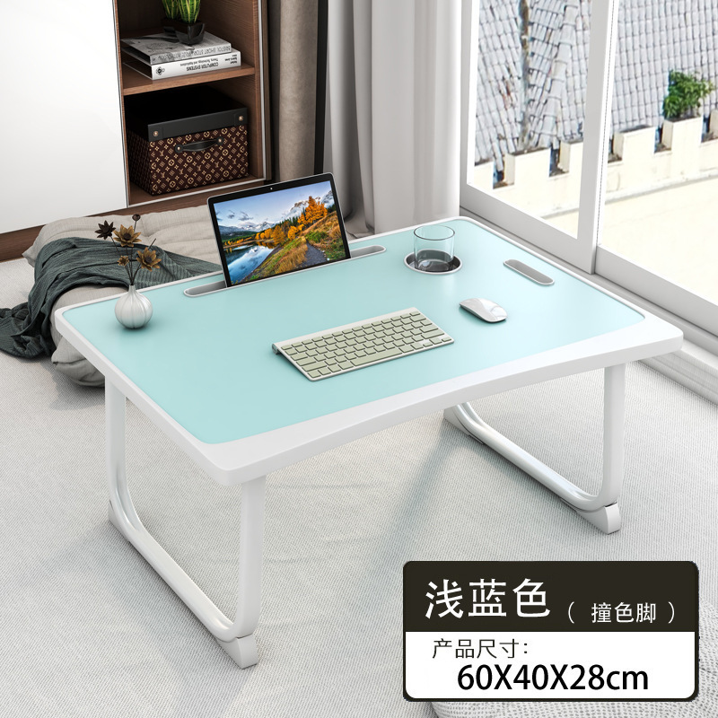 ベッドの上の机のノートパソコンの机は折りたたみ可能です。|undefined