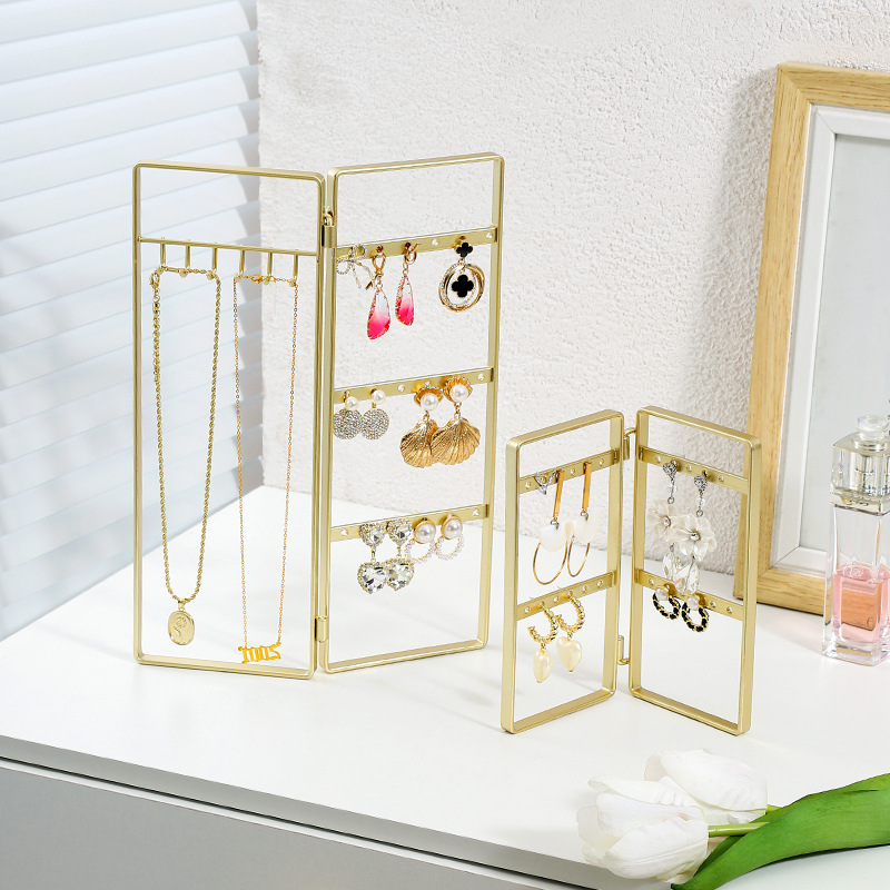 Scandinavian-style gold foldable jewelry display stand for necklaces, earrings, bracelets, and accessories.